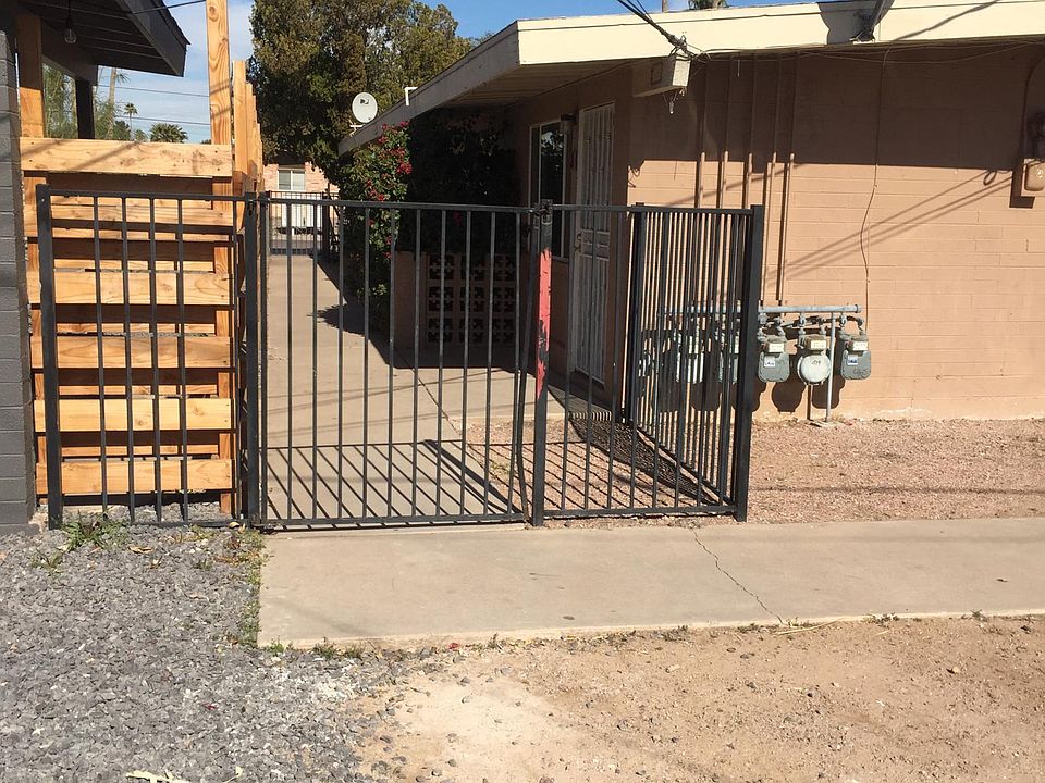 Ally access - front yard is fenced. Parking is in forefront.