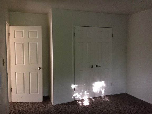 Bedrooms with large closets and fan