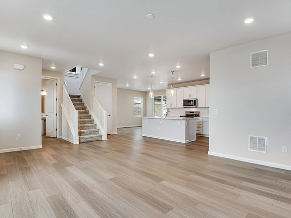 The living room is bathed in natural light