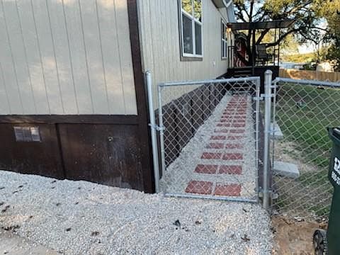 Front walk from the paved driveway.