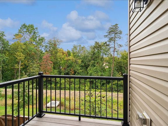 Deck overlooking trees.
