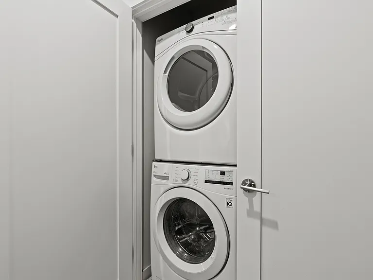 Stacked washer and dryer/utility closet