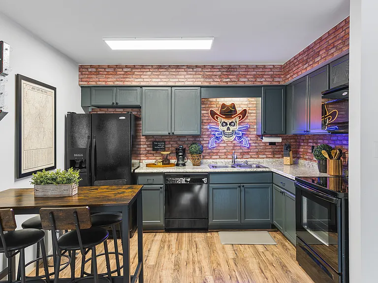Fully equipped kitchen for all of your cooking needs! Dining table with seating for 4.