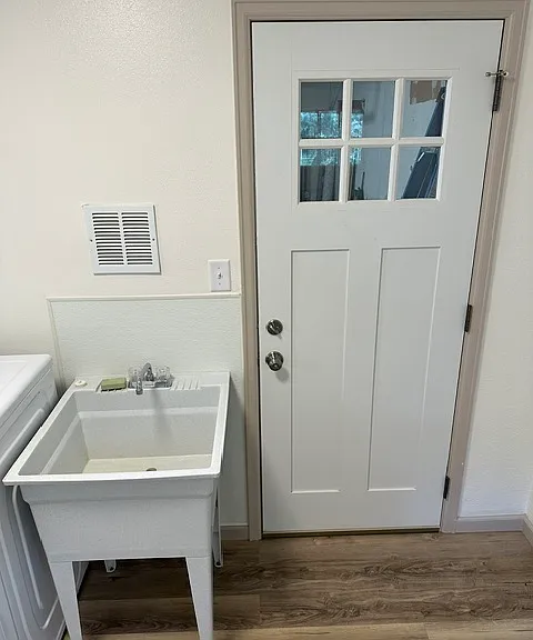 Laundry room exterior door to garage access.