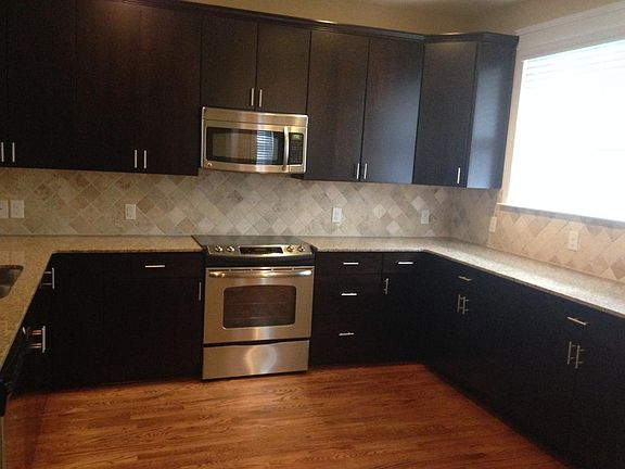 Kitchen with stainless steel appliances and granite countert