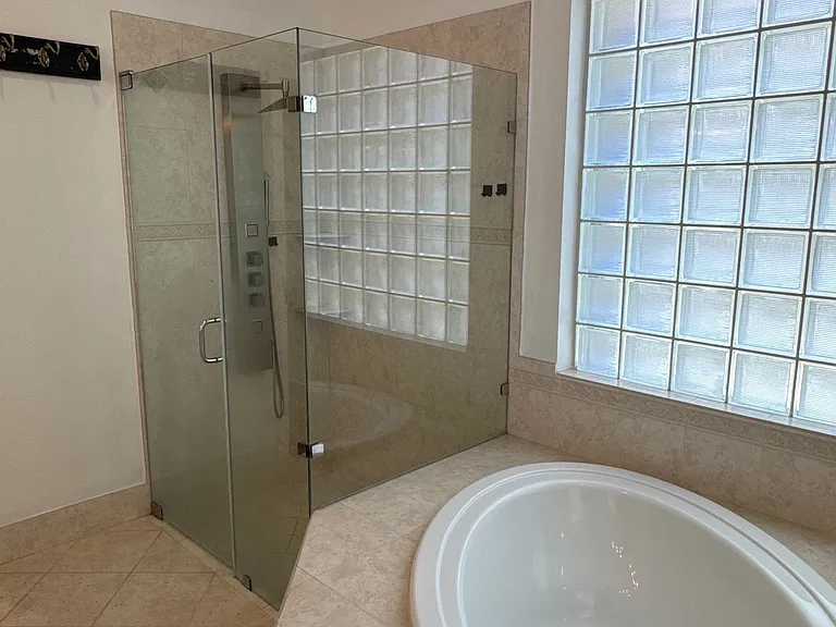 Walk in shower, with stainless shower system.