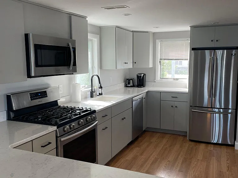 Open Plan Renovated Kitchen with Microwave, Range, Disposal, Toaster, Keurig, and Full-Size Refrigerator Freezer