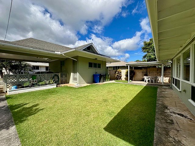 View of the Cottage, yard, Aloha Lanai and separate single family duplex.
