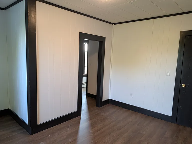 Master bedroom facing the door to the main entrance (right) and the door to the small bonus room (center).