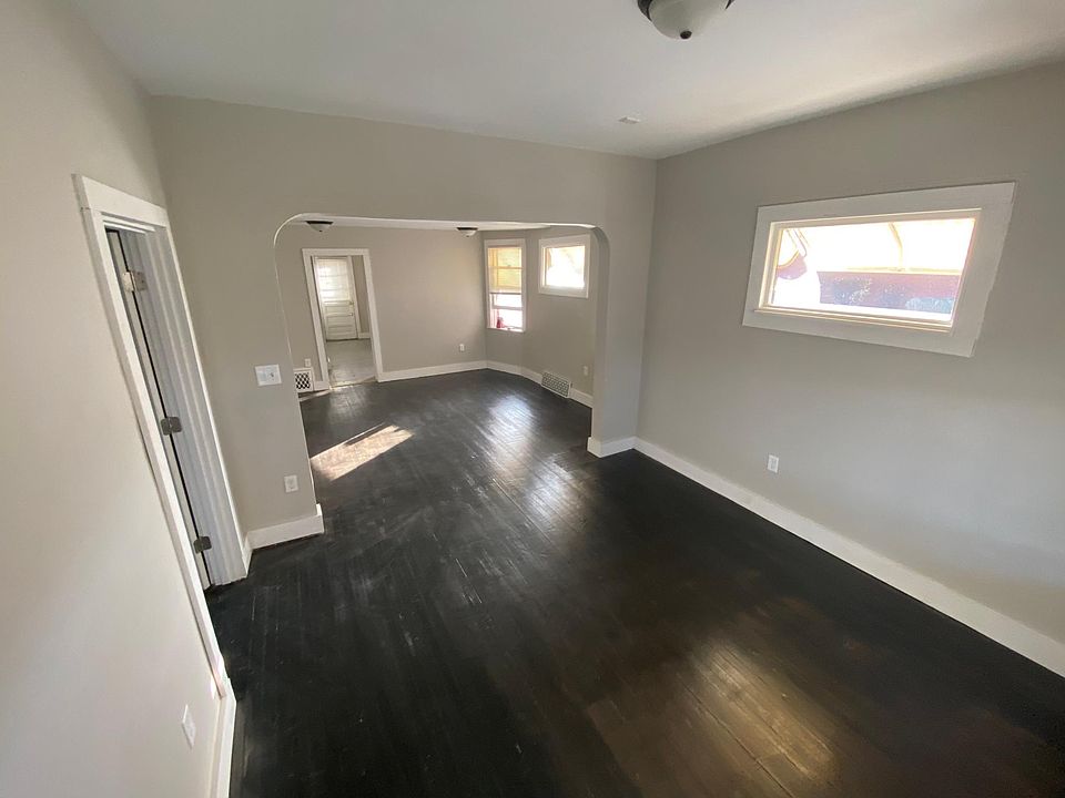 Living room and dining room from front door. Original hardwood floors!