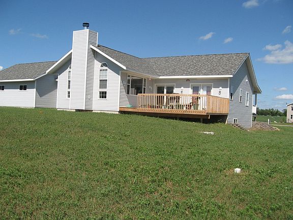 Back view, large deck off master bedroom and dining room