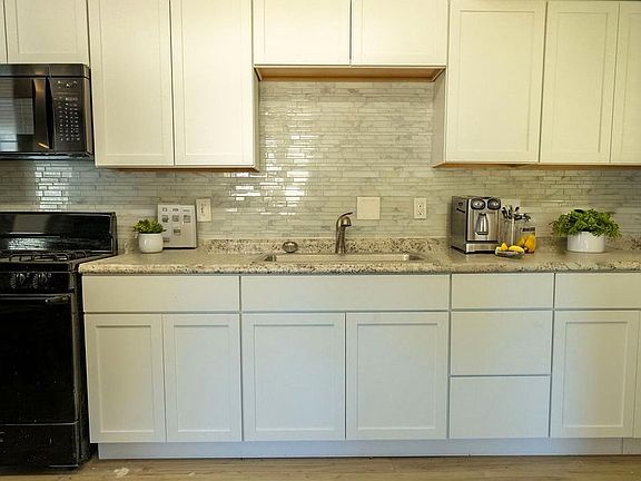Kitchen with new cabinets (handles to be installed)