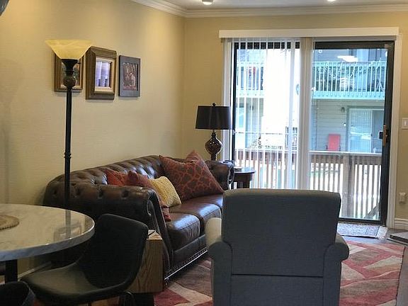 Additional view of living room out to patio