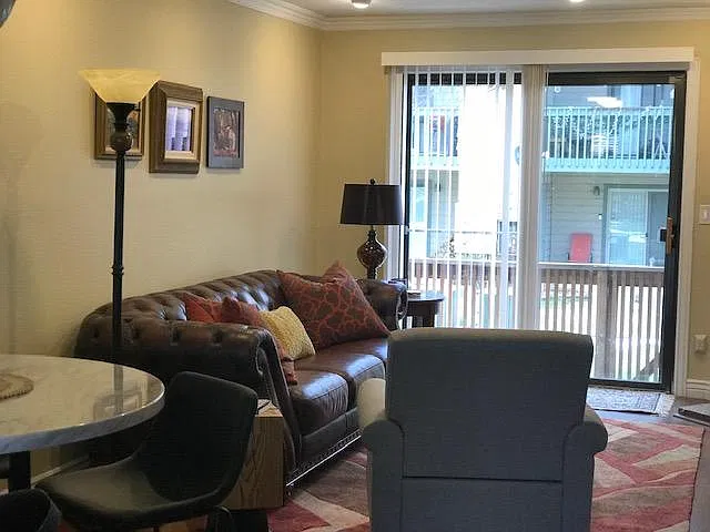 Additional view of living room out to patio
