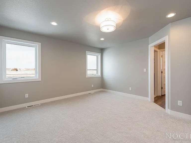 Master bedroom with ensuite bath and grand closet. (Photo of another unit with similar finishes and quality.)