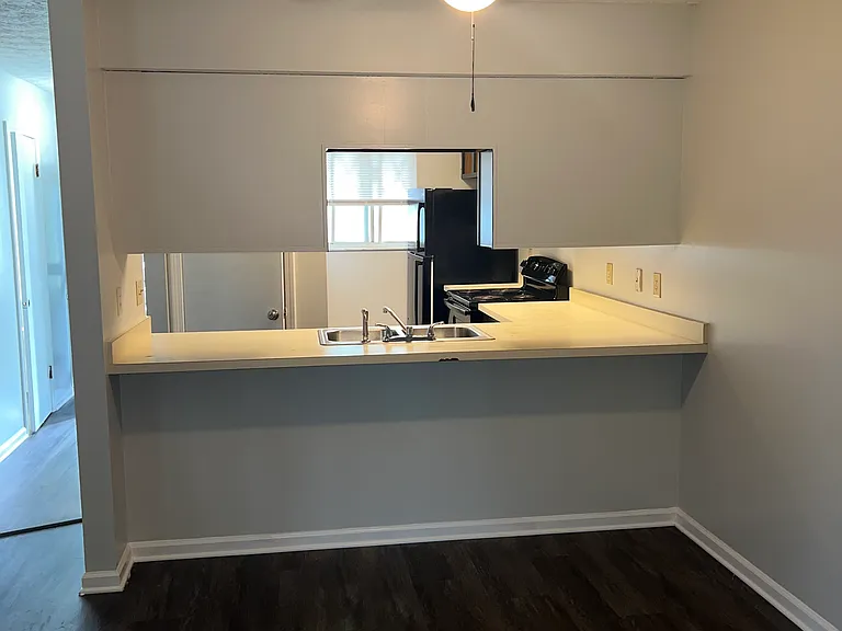 Dining Area with Ceiling Fan/View of Kitchen
