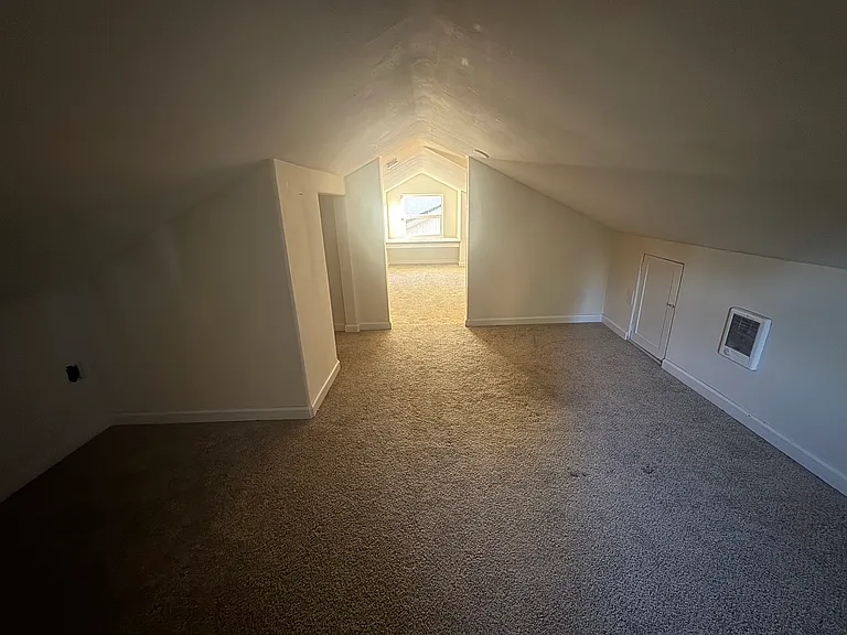 This shows the upstairs bedroom and the bonus room that leads into it, which has a cute window reading nook