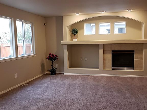 Spacious Family room with gas fireplace opens to kitchen