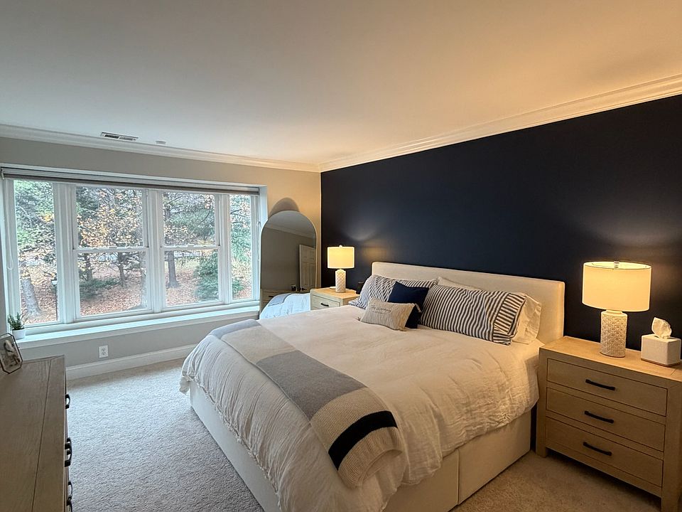 Large primary bedroom with walk-in closet and plenty of natural light.