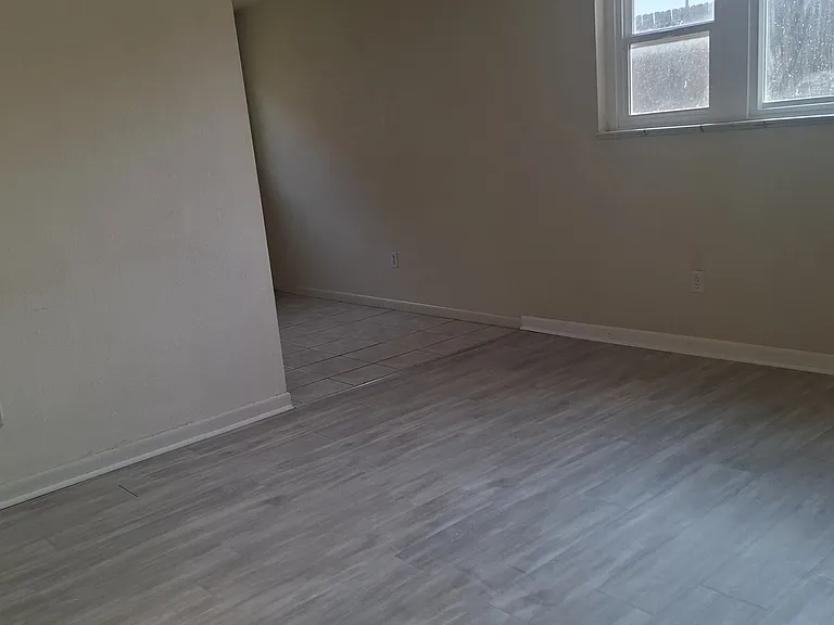 Looking to opposite wall from front door when walking in. Dining room is through entry way.