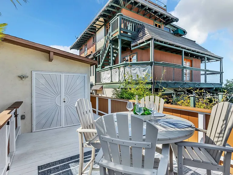 Second-floor terrace with comfortable outdoor seating and fantastic views. The perfect spot to unwind.
