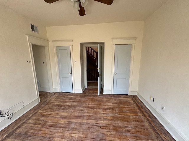 door to the unit from the hallway
right & left closet.
entry to living with bay windows facing East