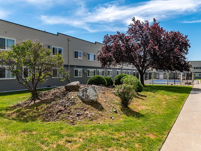 Americana | Outdoor Pool, Exterior Building and Walkway
