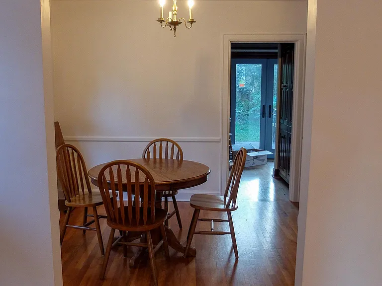 Looking from the living room through the dining room into the back kitchen area.