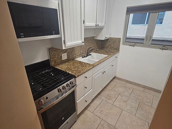 kitchen area with good cabinet space and updated appliances
