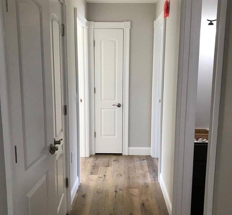 hallway closet on left, bathroom on immediate right, bedrooms located on left and right at end of hallway, with linen closet straight ahead
