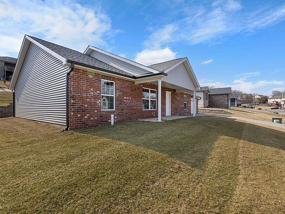 Brick and Vinyl one level home.