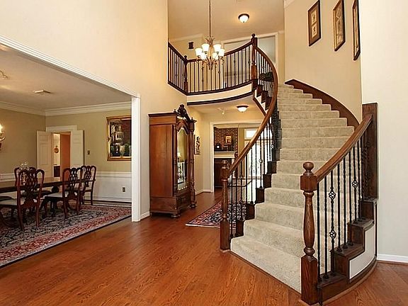 Dramatic entry with winding stairway
