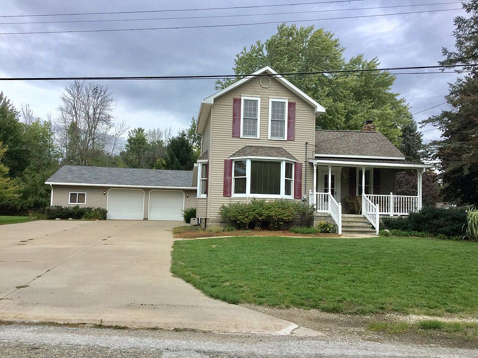 If you enjoy Midland's rail trail, why not live right by it?  This country home located on 2 lots is located in Lincoln Township - privately nestled yet very close to city conveniences either in Midland or Sanford.  This home has been remodeled with quality over the years with vinyl siding, Marvin windows, 2 septic tanks and fields just completed within the last 3 years plus city water.  The owner has nicely updated the kitchen with new counters, appliances, backsplash and ceramic flooring plus there is laminate wood flooring in the dining and living areas for today's style.  There are 2 bedrooms and 2 full bathrooms with a den/loft upstairs that could easily be converted to a 3rd bedroom if needed.  Step outside to a new front porch to relax on or head out back to the sauna and private decking.  You won't want to miss out on the huge garage - 2-1/2 car plus heated workshop and then you roam in to the best part!  The cool "man cave" that everyone in the family with love - Call Today!