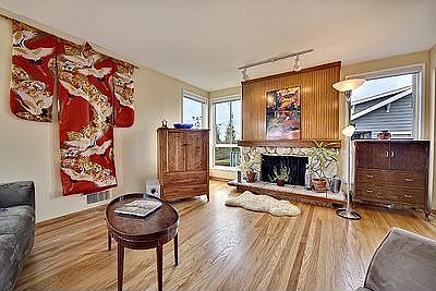 Living room boasts beautiful hardwoods and fireplace plumbed for gas insert.