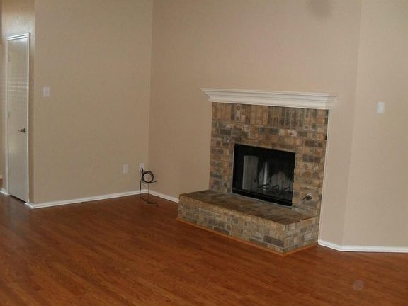 Wood burning fireplace in living room