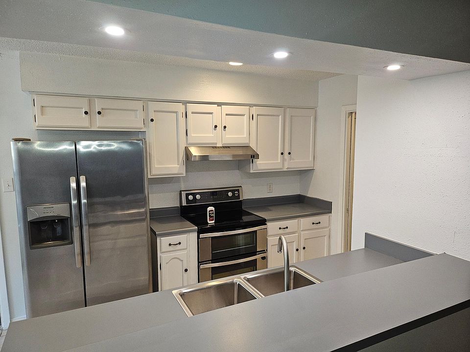 Updated kitchen with new deep sink and updated lighting. Double oven