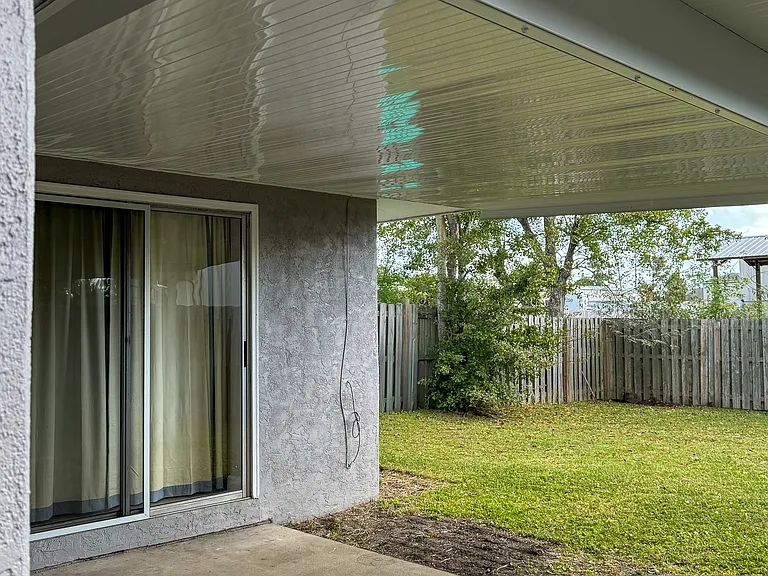 Back patio, hurricane strength covered roof to relax on.