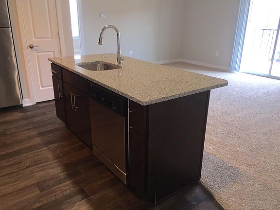 Kitchen islands offer additional casual seating, extra outlets and storage space, or can even be used as a separate work station!