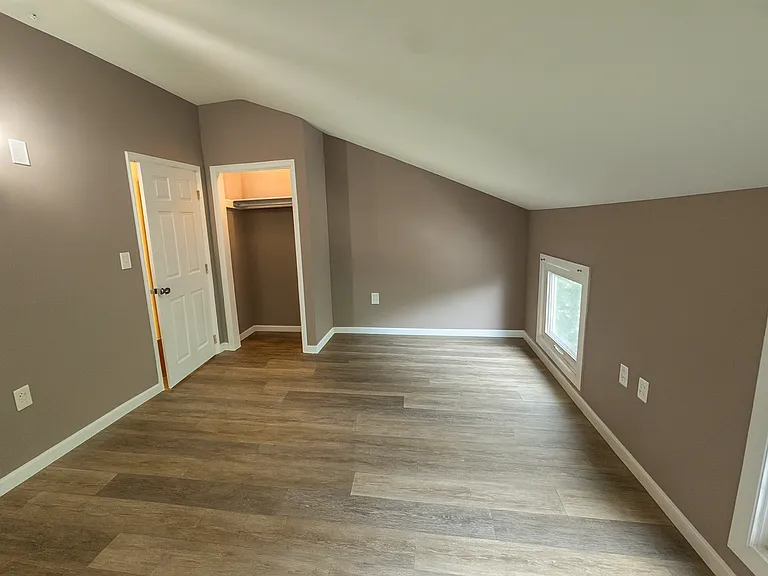 3rd Floor Front Bedroom. ** This photo was altered with similar flooring that is being installed
