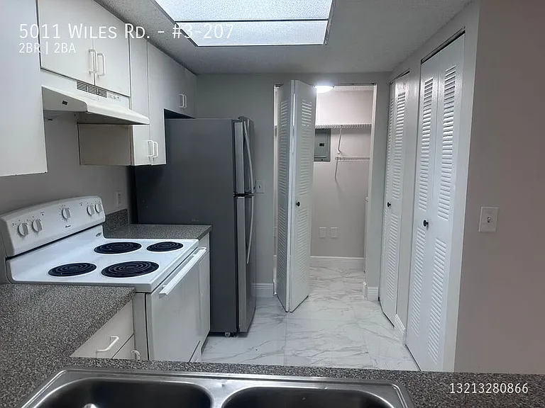 5011 Wiles Rd #3-207 — Photo 1