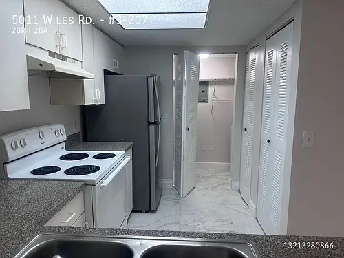 5011 Wiles Rd #3-207 Photo 1