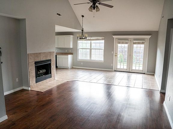 Open living area, dining area, & kitchen. Lots of natural Light. Light fixtures have been updated since photographed.