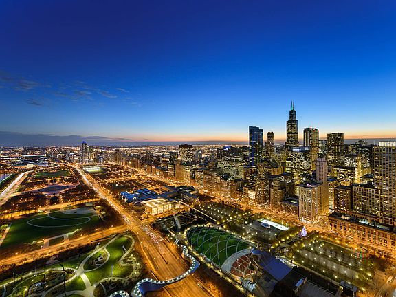 City lights come alive as the sun sets