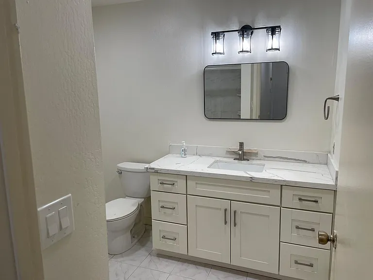 bathroom - new cabinets and countertop . Updated shower and tiles