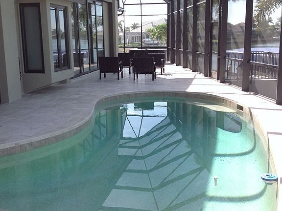 Pool with sundeck/2 seats.