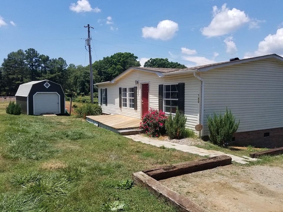 Sunny front porch entrance, parking for three vehicles easy, large storage barn is yours.