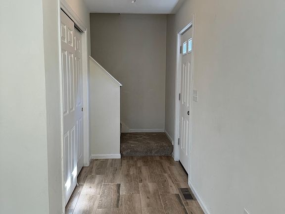 Entryway with coat closet.