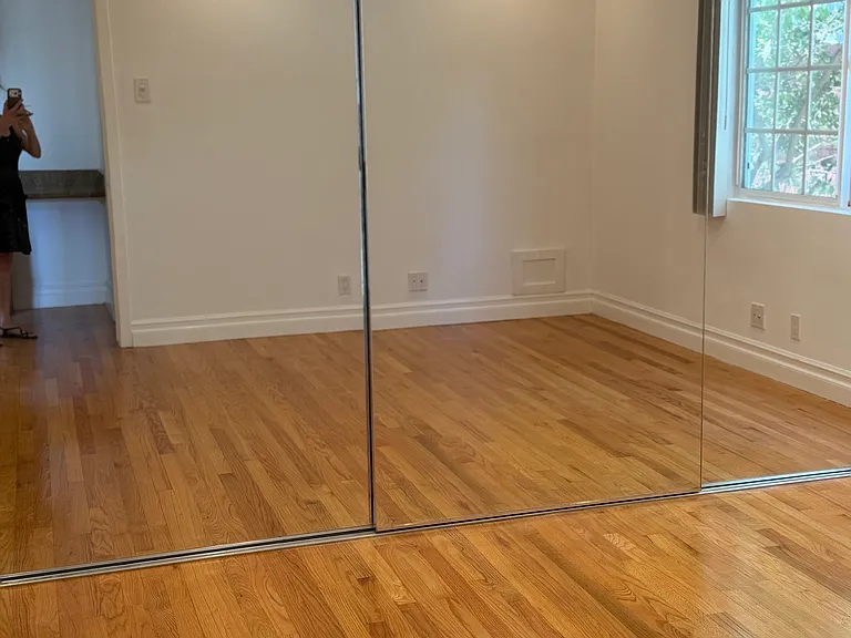 TRIPLE MIRROR CLOSET PROVIDES TONS OF HANGING SPACE