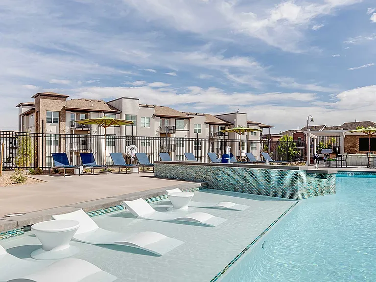 The Wright's outdoor pool area features expansive sundecks, in-water loungers, and comfortable gathering spaces designed for relaxation and connection.