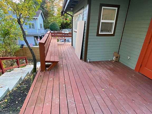 Spacious deck exclusive to the top unit. Perfect for morning coffee, relaxing outdoors, or enjoying the surrounding greenery